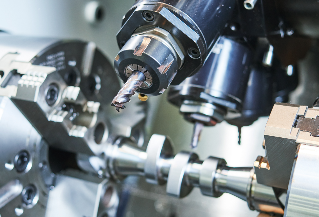 Close-up of precision CNC machining tool working on a metal component, representing accuracy and compliance in manufacturing.