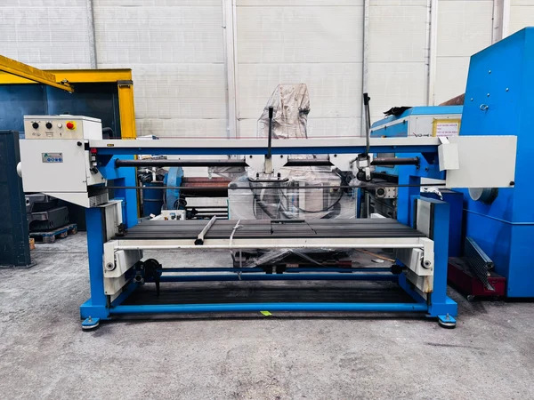 Metal Finishing Machine operating in an industrial facility with automated equipment and control systems. 